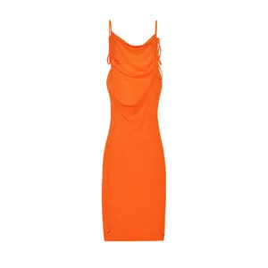 Front view detail of bright orange ruched bodycon dress with side drawstring ties