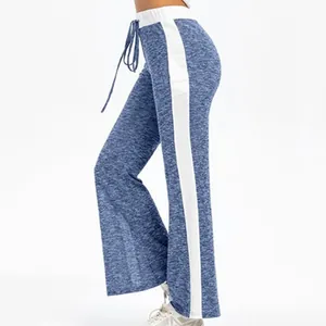 Detail of blue heathered wide-leg lounge pants featuring a contrasting white side stripe.