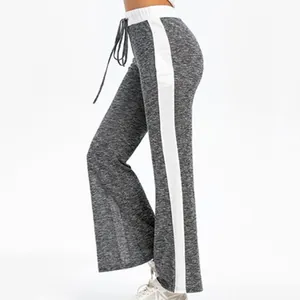 Close-up detail of women's grey marl wide-leg yoga pants with white side stripe and drawstring