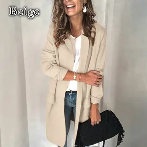 Close-up detail of a women's beige long-sleeved casual blazer with stylish faux pockets