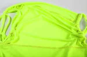 Detailed view showing the fine stitching and neon green fabric texture of this dress