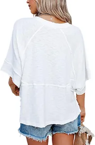 Back view of a casual loose white T-shirt featuring bell sleeves and textured fabric.