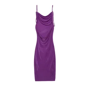 Detailed view of a purple ruched bodycon dress featuring elegant backless design.