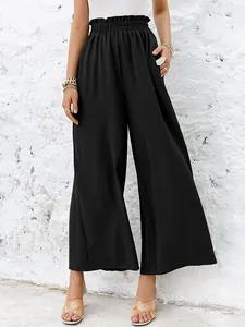 Detailed look at high-waisted black wide-leg cotton linen trousers with texture