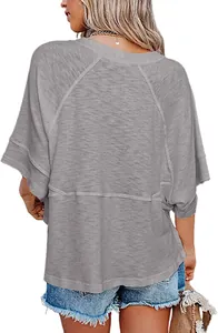 Detailed back view of loose grey summer t-shirt with 3/4 flare sleeves and seam detail