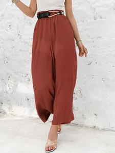 Detail view of women's rust red high-waisted cotton linen wide-leg casual pants