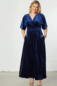 Detail view showing luxurious dark blue velvet texture on V-neck short sleeve dress