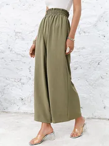 Fashionable high-waisted olive green wide-leg pants with ruffled elastic waist shown on model