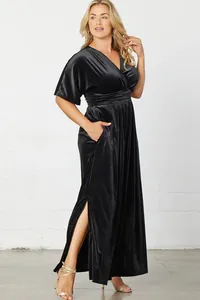 Elegant black velvet V-neck maxi dress featuring a side slit and functional pockets