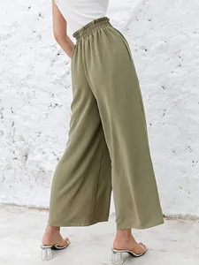 High-waisted olive green wide-leg trousers in a textured cotton-linen fabric blend