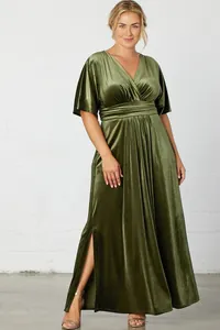 Close-up of elegant moss green velvet maxi dress featuring V-neckline and high side slit detail.