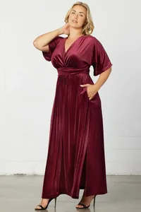 Elegant burgundy velvet maxi dress featuring V-neck and short butterfly sleeves with side slit