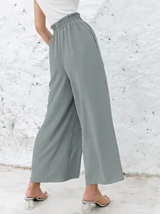 Detailed back view of high-waisted cotton linen wide-leg trousers in sage green color