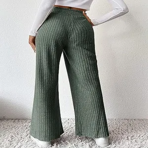 Detailed back view of women's casual sage green ribbed knit wide-leg trousers on model