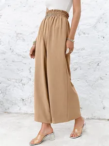Detailed shot of high-waisted wide-leg loose casual trousers in solid khaki cotton linen blend