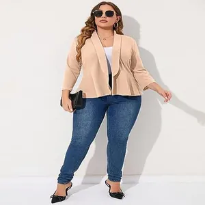 Elegant plus size khaki ruffle hem blazer styled with blue jeans in a studio setting
