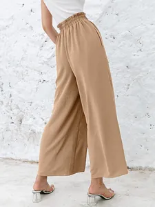 Side-back view of khaki solid color high waist wide-leg trousers with elastic waistband