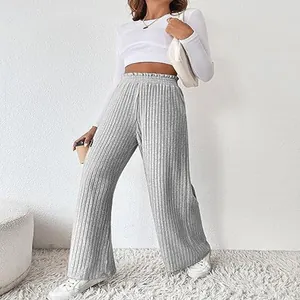 Close-up of women's grey ribbed knit wide-leg trousers for autumn and winter