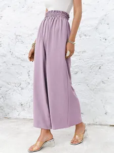 Close-up detail of high waist loose casual wide-leg pants in purple cotton linen fabric