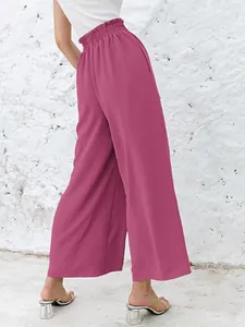 Detailed back view of high-waisted pink wide-leg cotton linen trousers for casual wear.