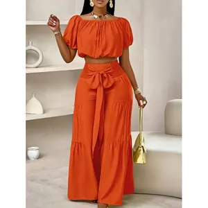 Ensemble deux pièces orange avec pantalon large taille haute et haut court