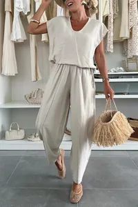 Detailed shot of women's summer beige linen-like lounge set with V-neck top and wide pants