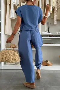 Back view of a casual blue summer two-piece set for women in a closet setting