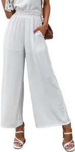 Close-up view of white high-waisted cotton linen wide-leg pants with elastic waist