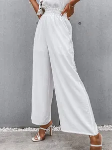 Detail view of white high-waisted cotton linen wide-leg pants for a loose casual look