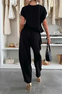 Back view of a summer black casual matching set with short-sleeve top and trousers