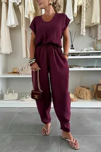 Elegant summer burgundy linen two-piece casual set for women shown in boutique setting