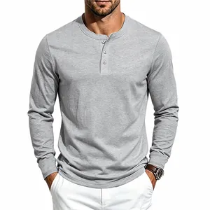 Detail view of a men's grey long-sleeved Henley knit shirt with buttoned collar