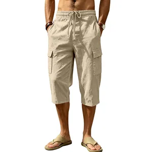 Close-up detail of men's loose linen cargo capri pants with elastic drawstring waist