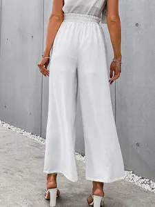 Back view of elegant white high waist wide leg cotton linen pants for women