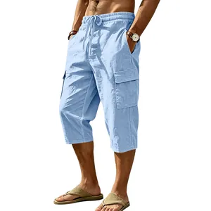 Detailed view of men's light blue summer linen cargo cropped pants with pockets.