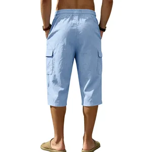 Detail view showing the back profile of men's blue linen cargo three-quarter shorts.
