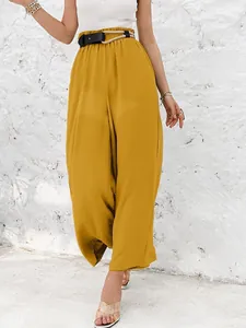 Detailed view of mustard high-waisted wide leg trousers with rope belt decoration