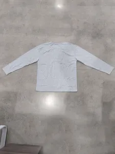 Back view of a plain grey long-sleeve Henley shirt laid flat on a surface