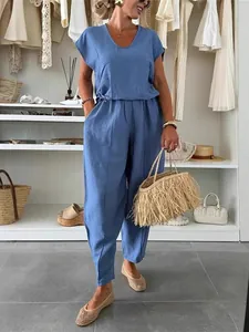 Stylish summer blue linen two-piece set with a V-neck short-sleeve top and loose pants