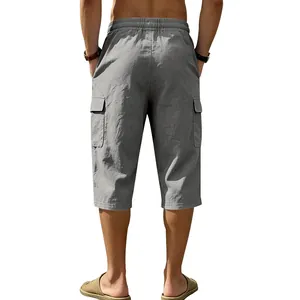 Detailed back view of men's gray linen cargo capri pants featuring elastic waist and pockets