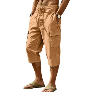 Detailed view of men's linen cargo shorts featuring elastic waist and large side pockets.