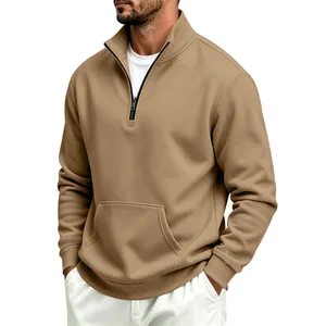Detail of khaki men's quarter-zip sweatshirt showing kangaroo pocket and warm fleece texture.
