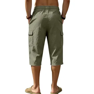 Back view of men's summer breathable linen casual loose cargo shorts in army green color