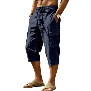 Detailed view of men's navy blue linen cargo capri pants featuring a drawstring waist