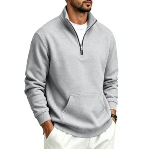 Detail of men's grey half-zip fleece sweatshirt featuring stand collar and pocket