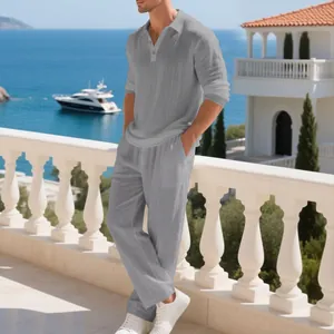 Close-up detail of men's linen casual beach set with a grey long-sleeve polo and pants