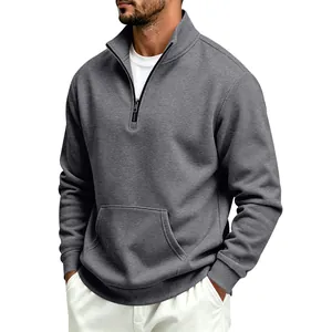 Close-up of men's grey half-zip sweatshirt featuring stand collar and kangaroo pocket