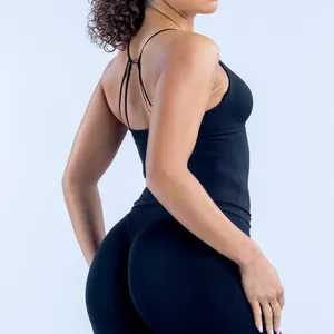 Back view detail of seamless black yoga tank top with thin criss-cross straps for women