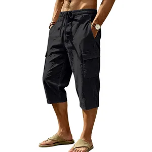 Close-up detail of men's black linen cargo cropped pants featuring drawstring waist