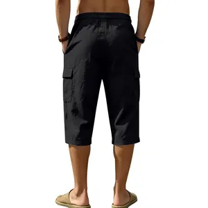 Back view of men's loose black linen cargo 3/4 shorts for summer beach casual wear.